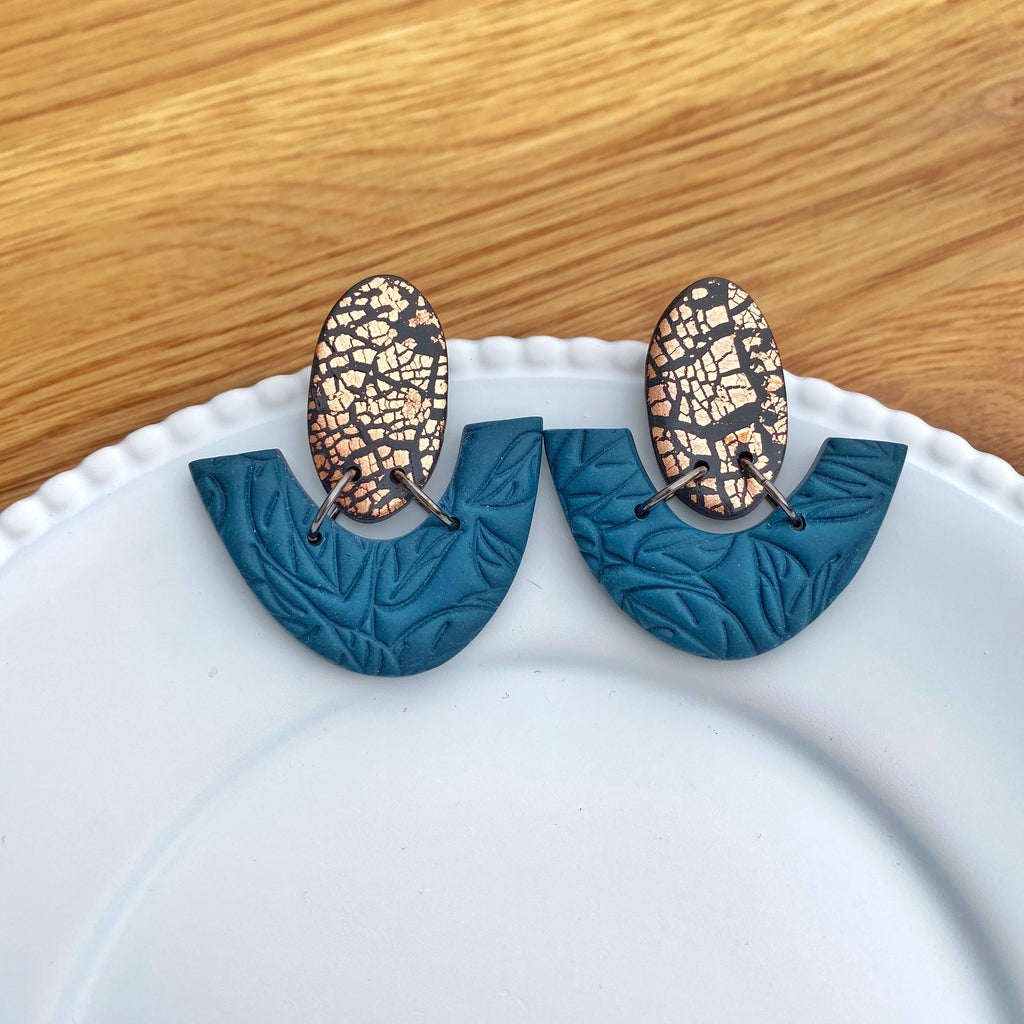 Oval and half donut teal with copper statement earring