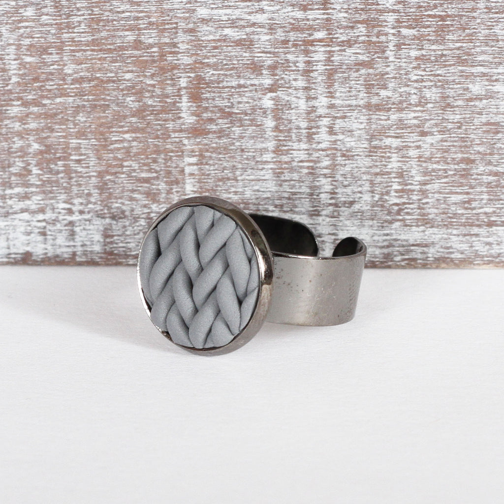Grey knitted clay ring