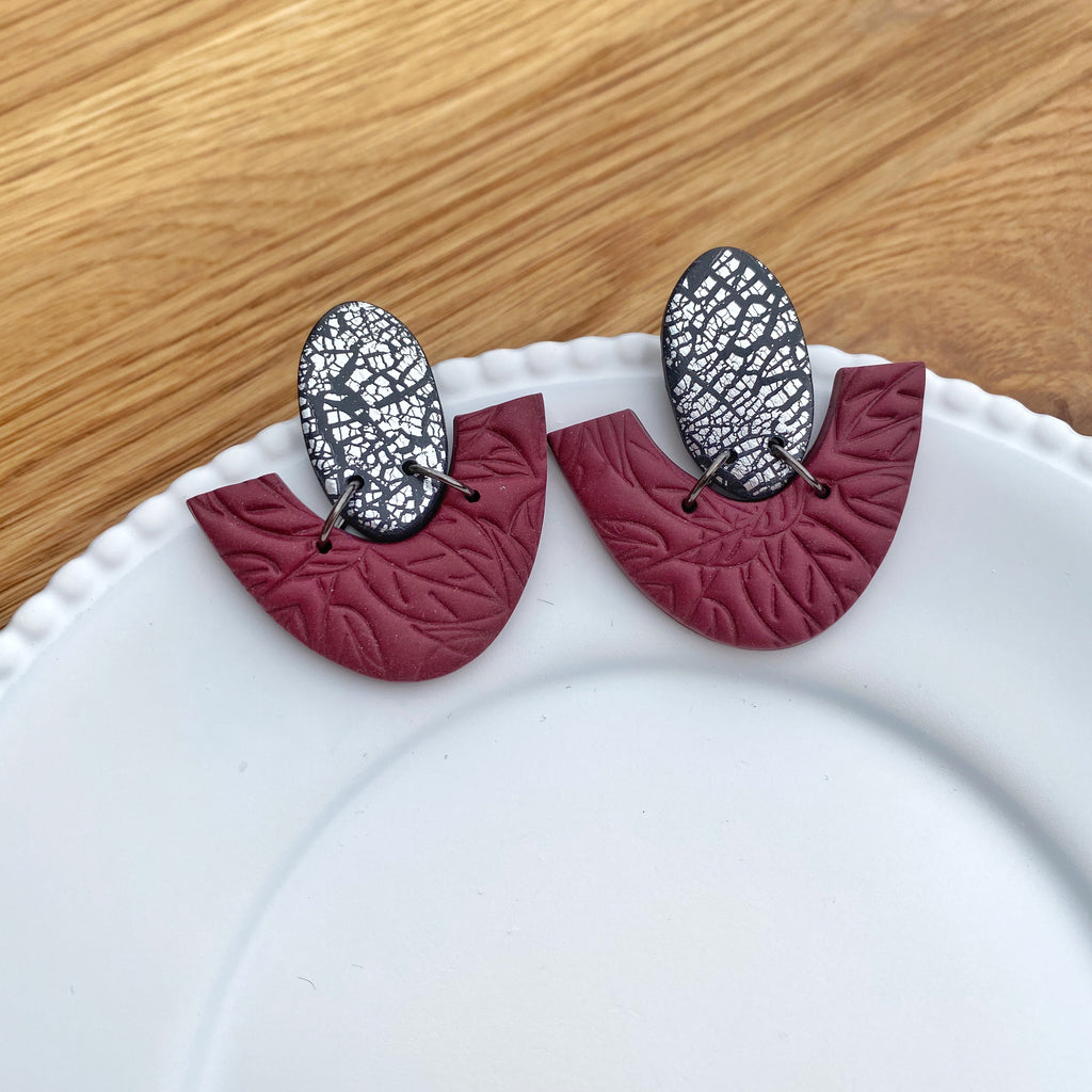 Oval and half donut burgundy with silver statement earring