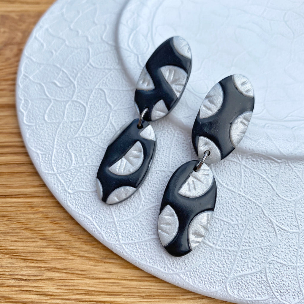 Black with pearl segment pattern statement earrings - double oval drop