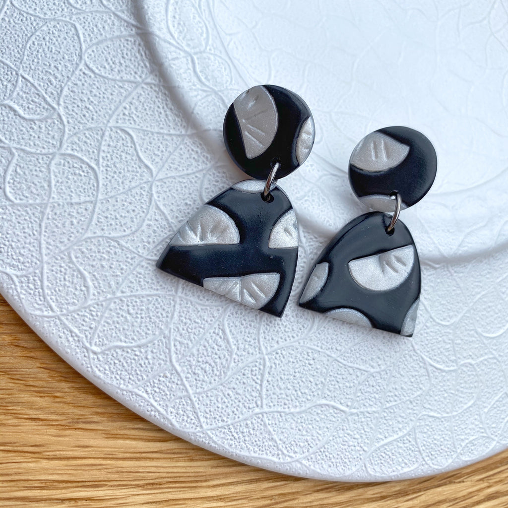 Black with pearl segment pattern statement earrings - half oval drop
